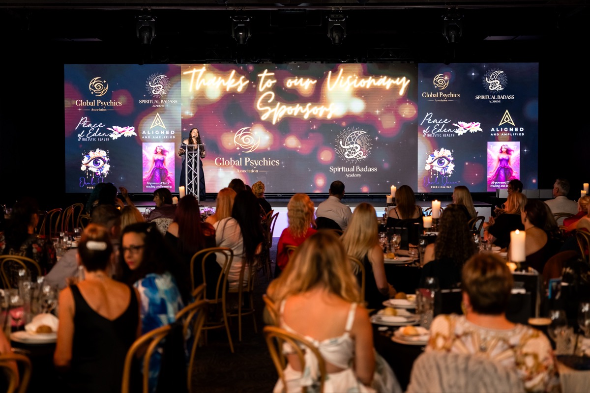 Kelly presenting to a room of women